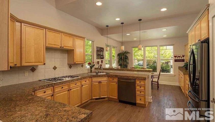 5001 Fall Colors Court Reno, NV 89519 - Photo 8 of 36 a kitchen with stainless steel appliances granite countertop a sink a stove and refrigerator