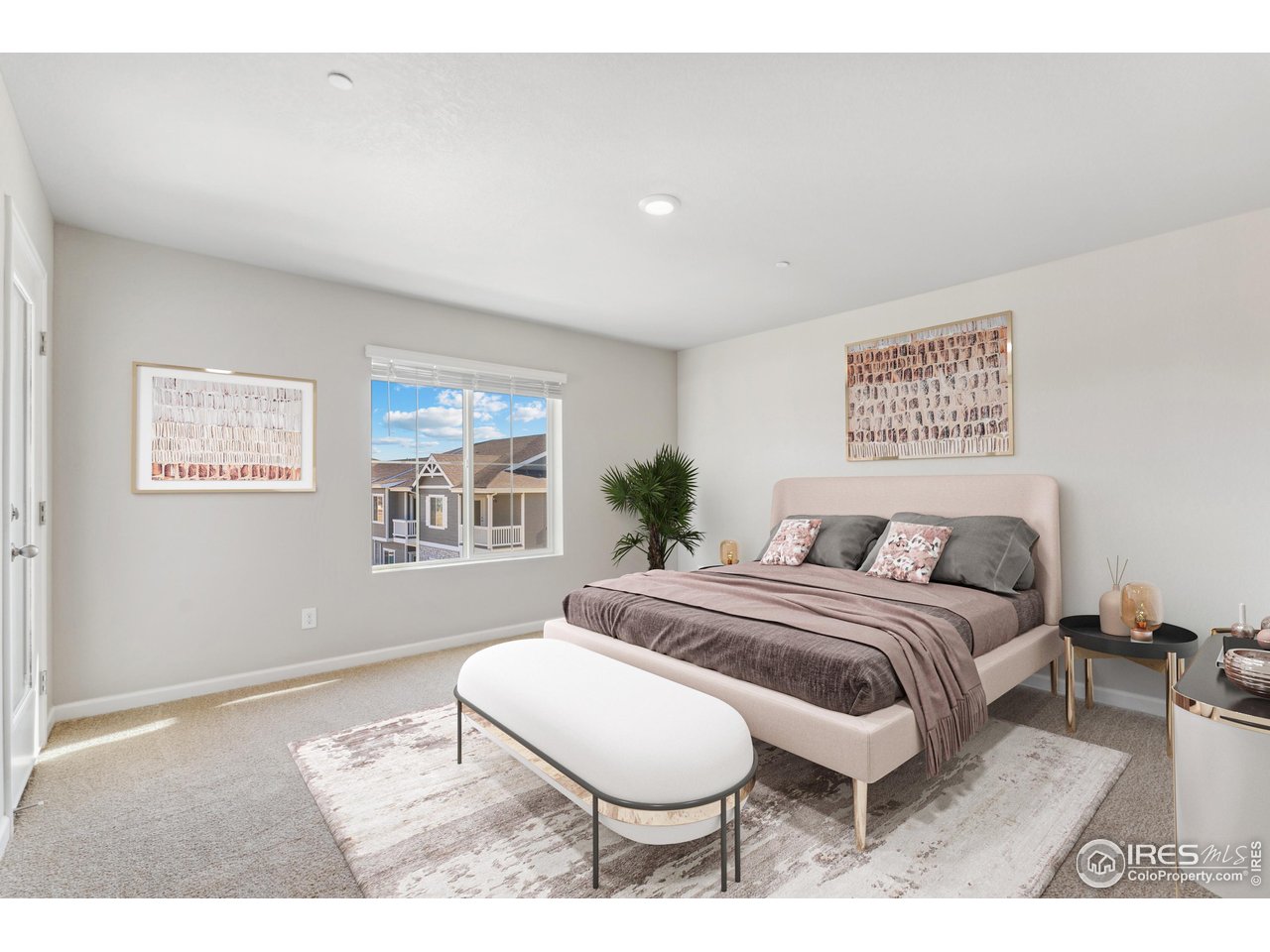 127 Robin Road Johnstown, CO 80534 - Photo 6 of 24 a bedroom with a bed lamp and a window