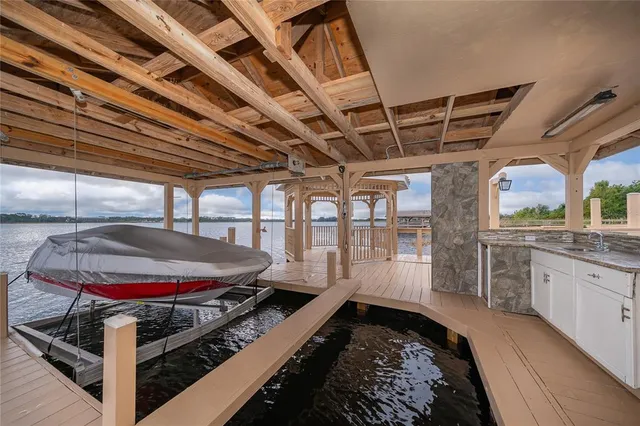 a kitchen with white cabinets and counter space
