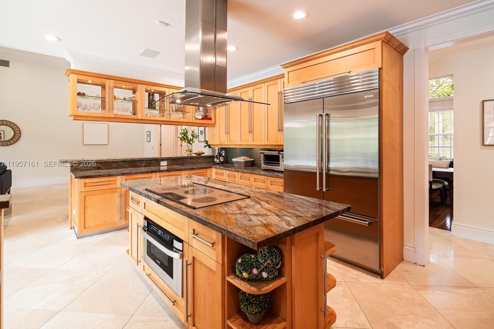5770 Southwest 128th Street Pinecrest, FL 33156 - Photo 16 of 37 a kitchen with stainless steel appliances granite countertop a stove and a refrigerator