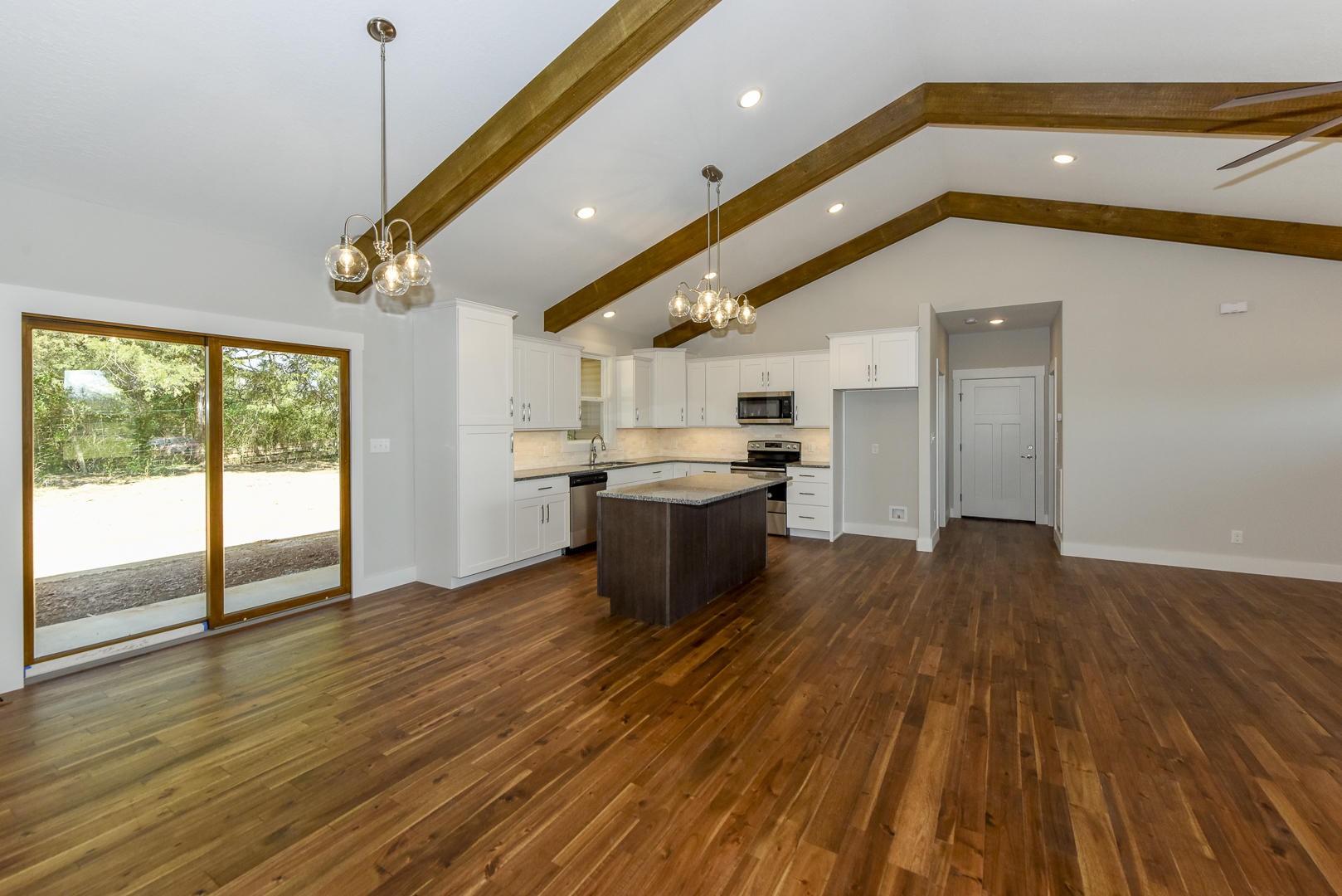 3059 New Blockhouse Road Maryville, TN 37803 - Photo 11 of 33 a view of a living room with wooden floor and a ceiling fan