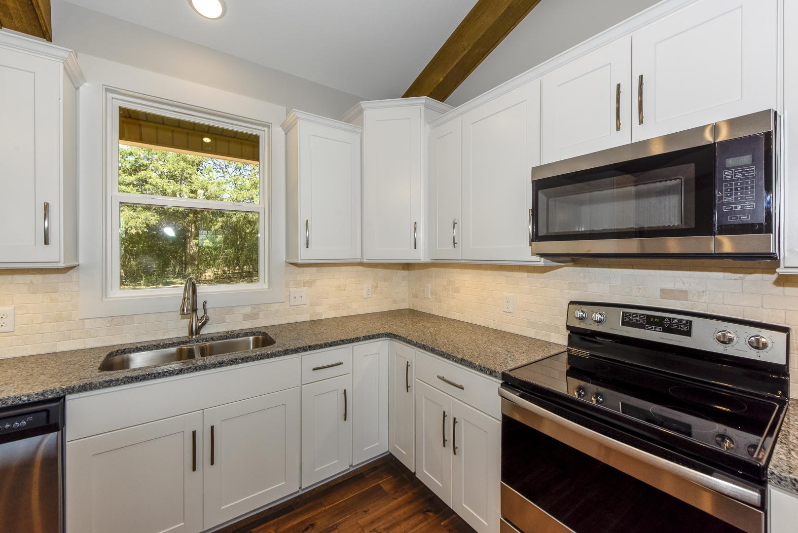 3059 New Blockhouse Road Maryville, TN 37803 - Photo 13 of 33 a kitchen with sink a microwave a stove and cabinets