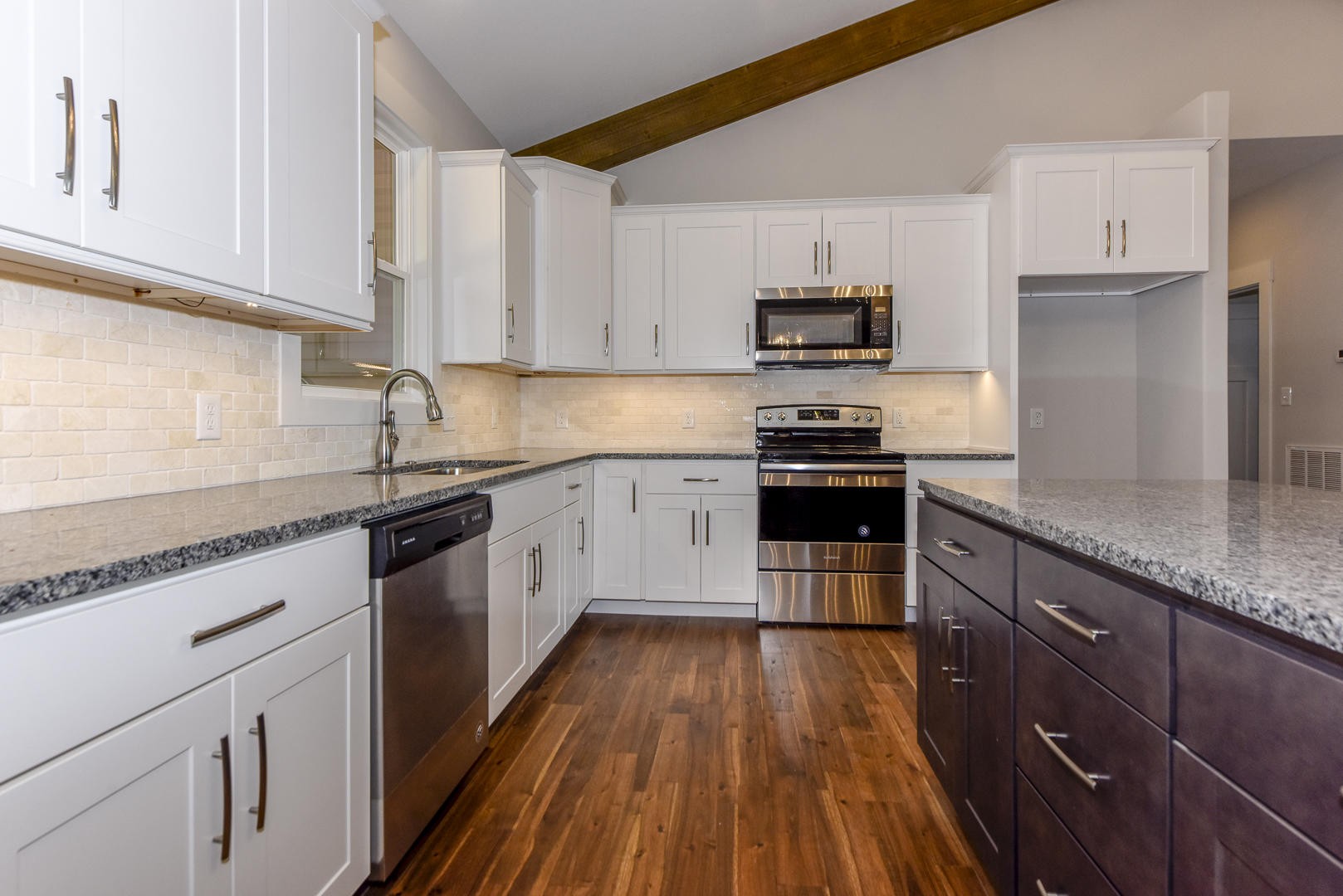 3059 New Blockhouse Road Maryville, TN 37803 - Photo 14 of 33 a kitchen with granite countertop wooden floors stainless steel appliances and sink