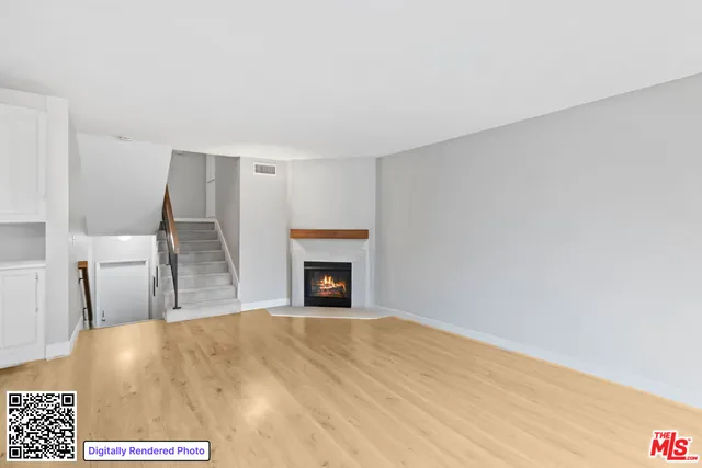 a kitchen with stainless steel appliances a stove a sink and a refrigerator