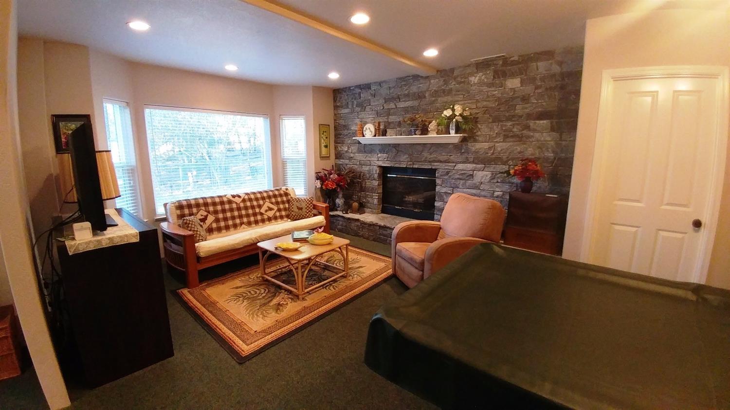 1390 Crow Road Merlin, OR 97532 - Photo 11 of 35 a living room with furniture and a fireplace