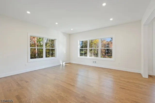 a white bath tub sitting in a bathroom next to a window
