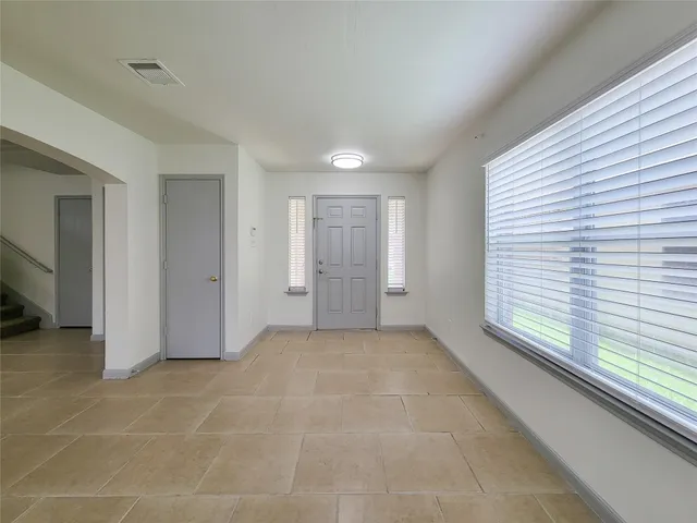 a view of an empty room with a window