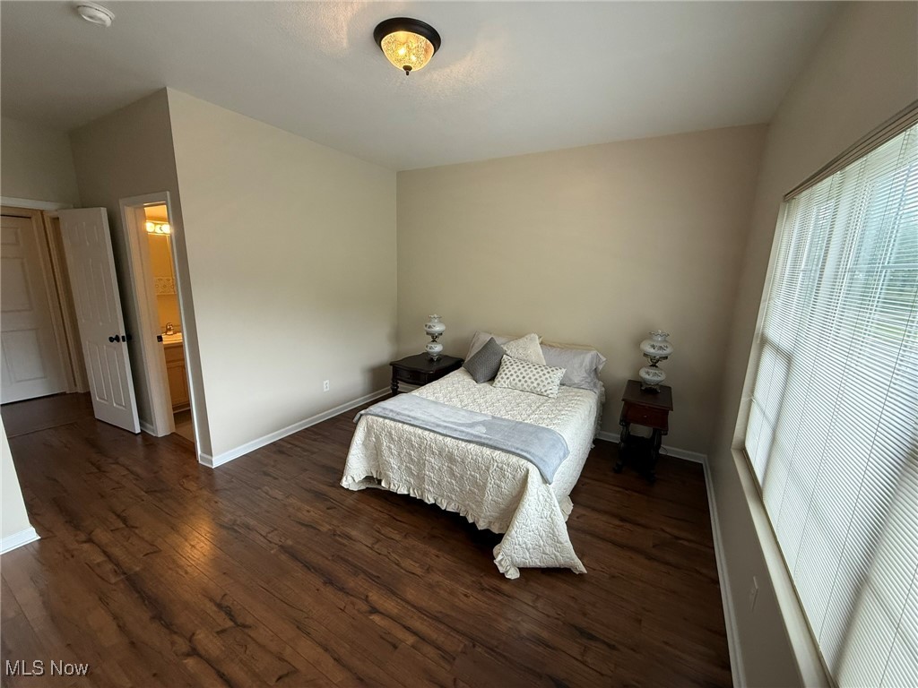 5645 Clingan Road, Unit 2D Struthers, OH 44471 - Photo 25 of 50 Bedroom featuring dark wood-type flooring and baseboards