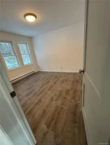 a bathroom with a toilet and a bathtub