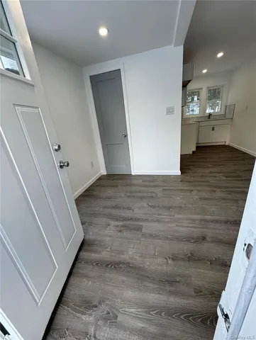 a view of a hallway with stairs