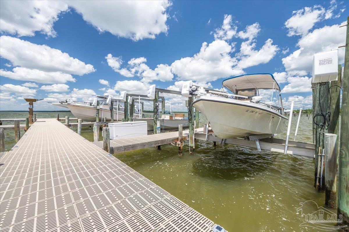 26063 Canal Road, Unit 3F Orange Beach, AL 36561 - Photo 65 of 72 a view of a swimming pool with a patio