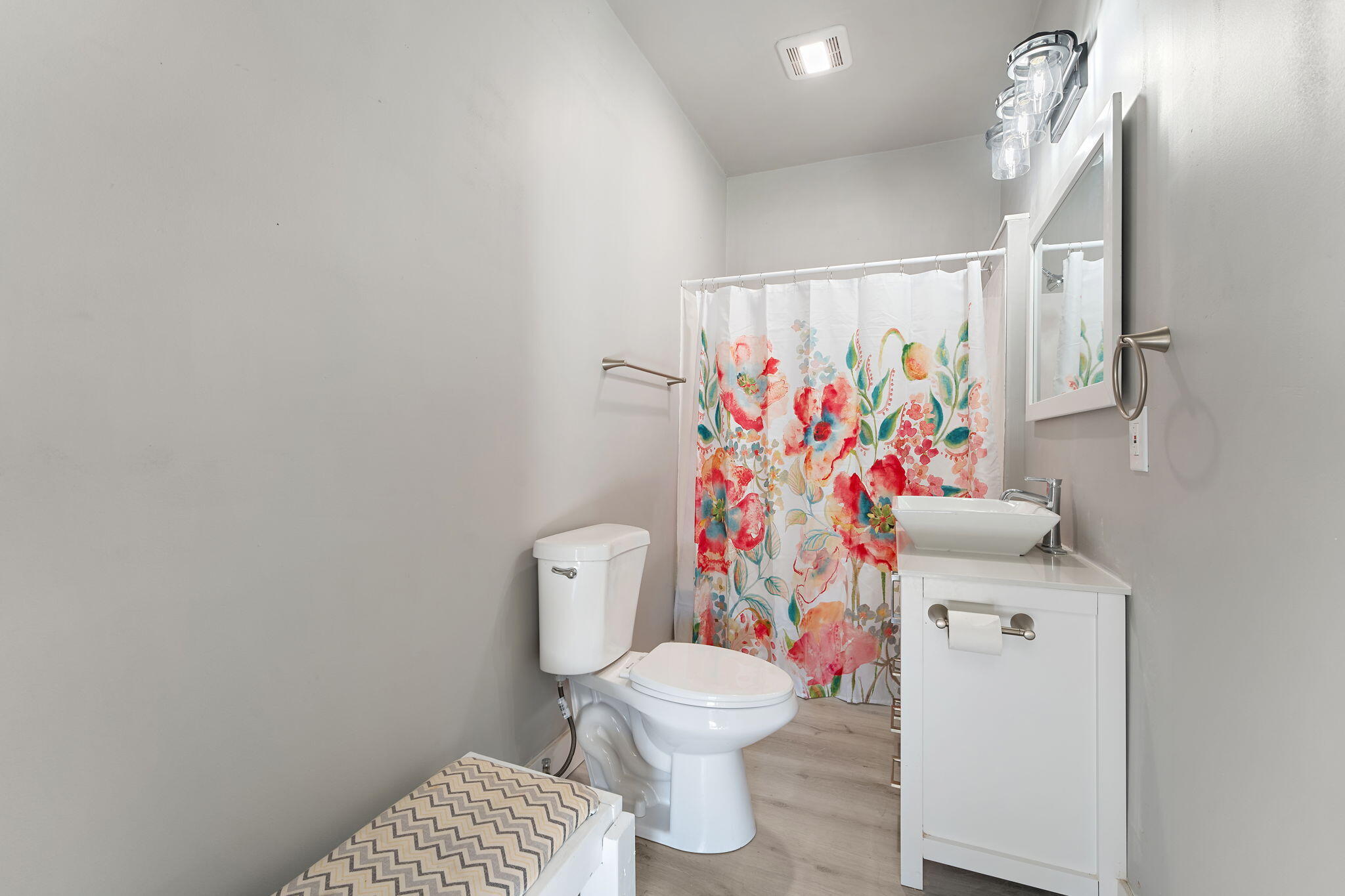 813 Carnation Street Southeast De Motte, IN 46310 - Photo 17 of 26 a white toilet sitting next to a bathroom sink