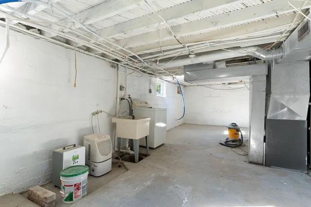 a view of storage and utility room with empty racks