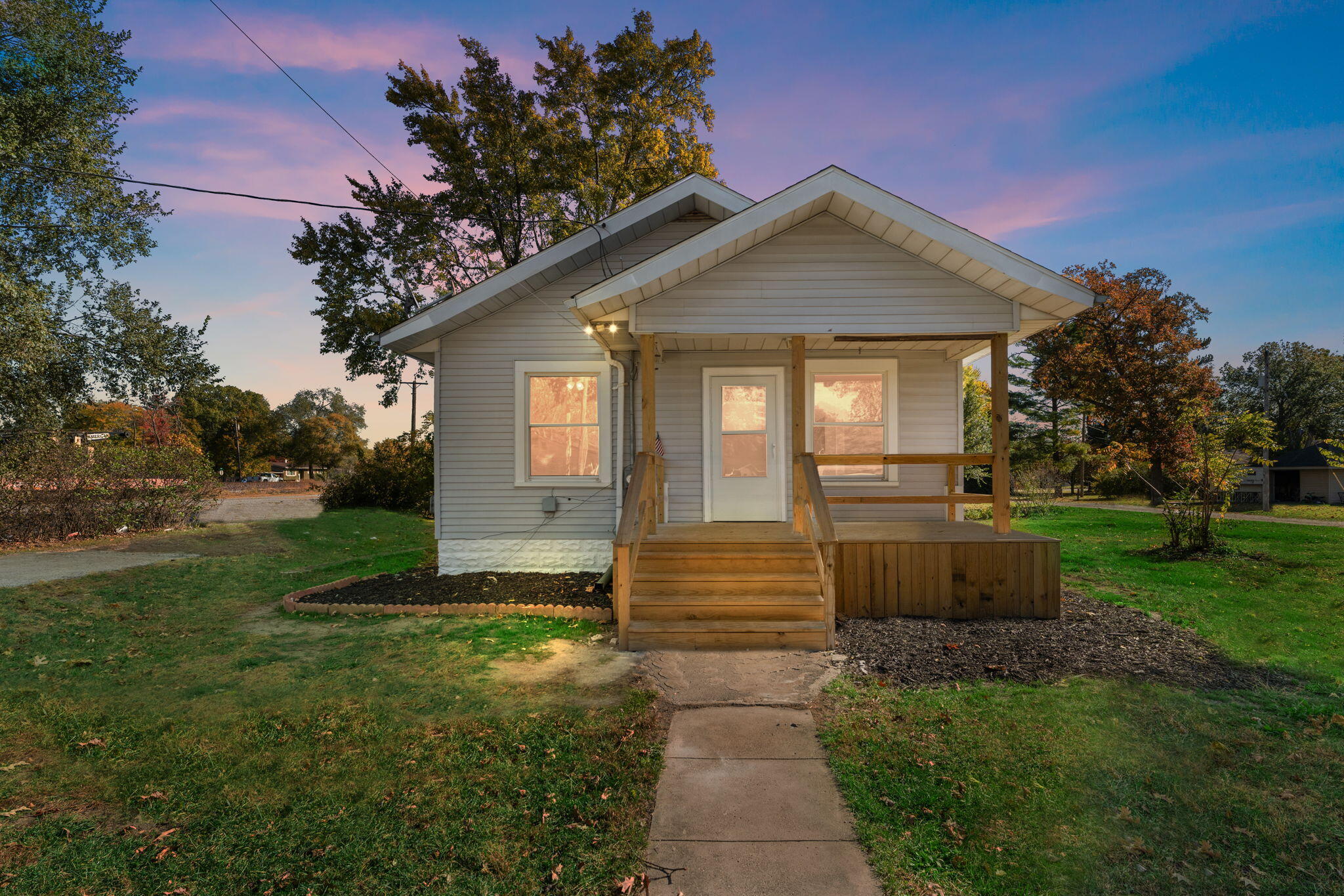 813 Carnation Street Southeast De Motte, IN 46310 - Photo 2 of 26 a front view of a house with garden