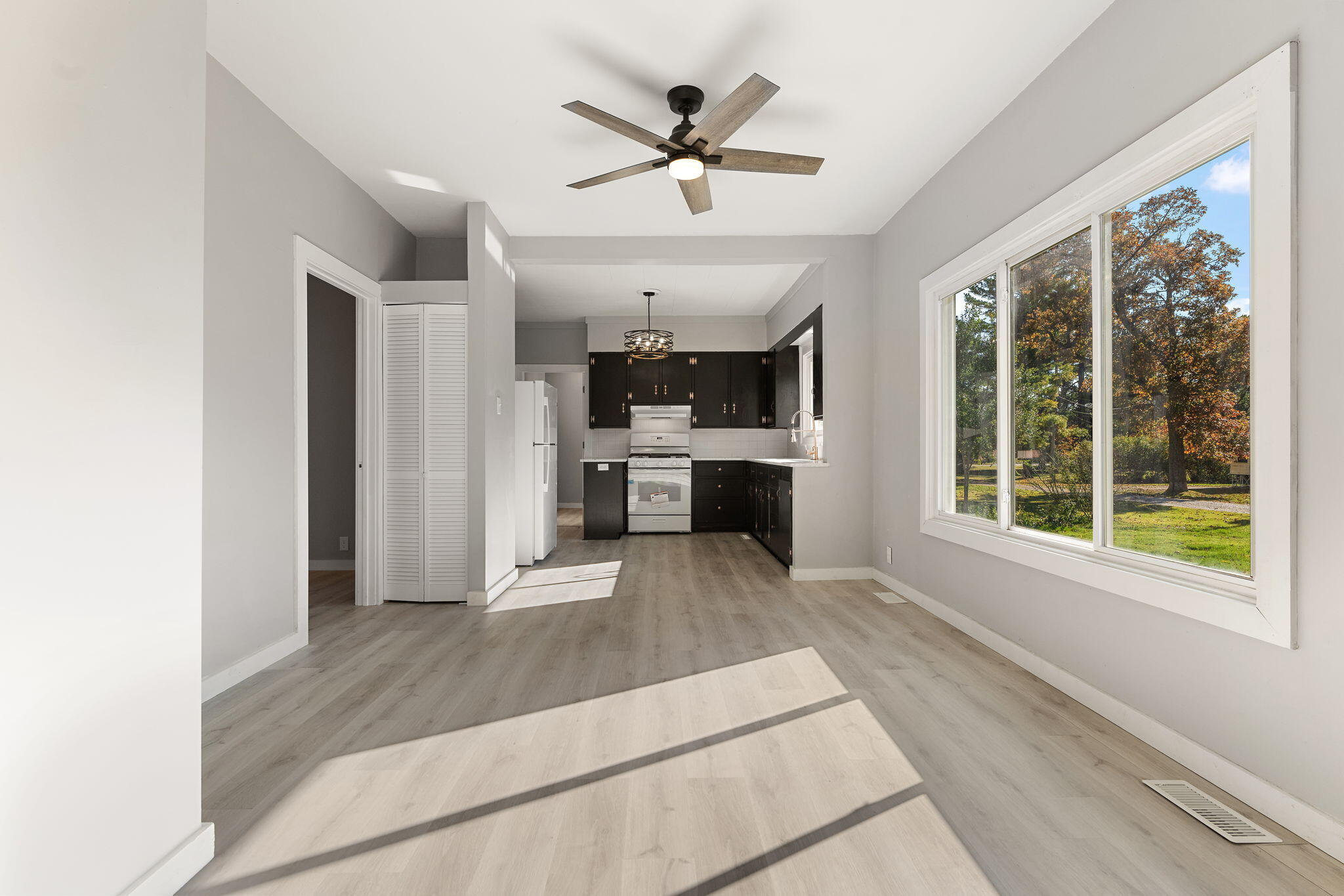 813 Carnation Street Southeast De Motte, IN 46310 - Photo 9 of 26 a open kitchen with stainless steel appliances granite countertop a refrigerator and a sink