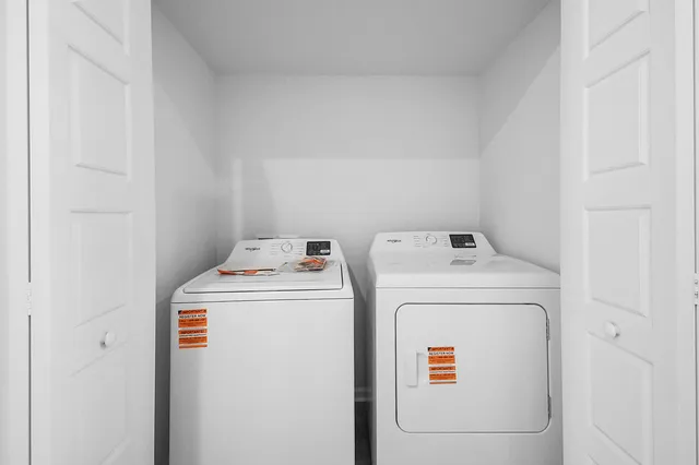 a utility room with dryer and washer
