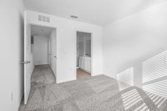 a view of a big room with closet and wooden floor