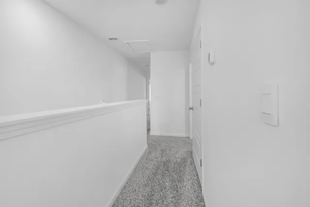 a view of hallway with closet