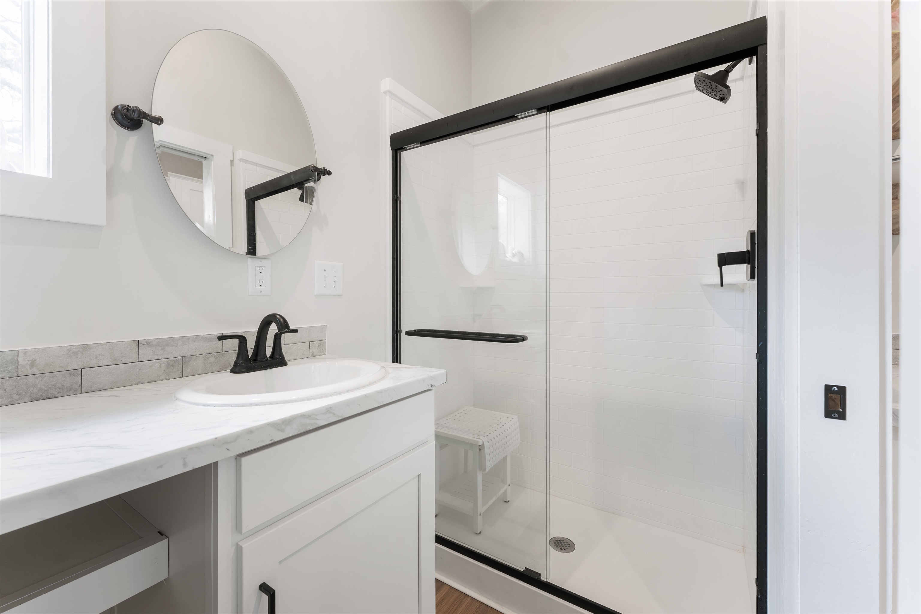 330 Whitley Road Oakland, TN 38060 - Photo 11 of 19 Modern bathroom featuring a walk-in shower with clear glass enclosure and matte black hardware