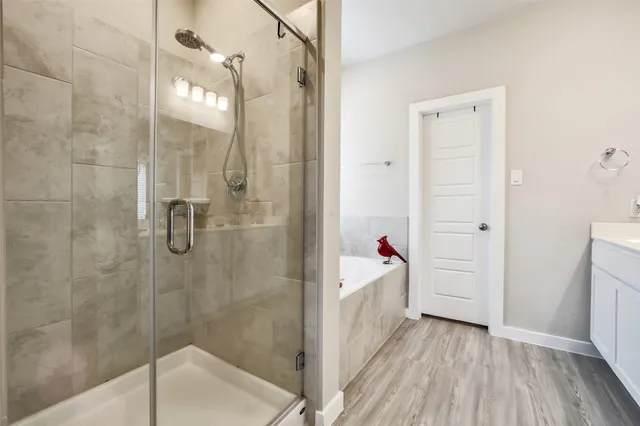 a bathroom with a sink and shower