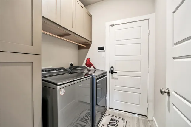 a kitchen with stainless steel appliances a stove microwave and refrigerator