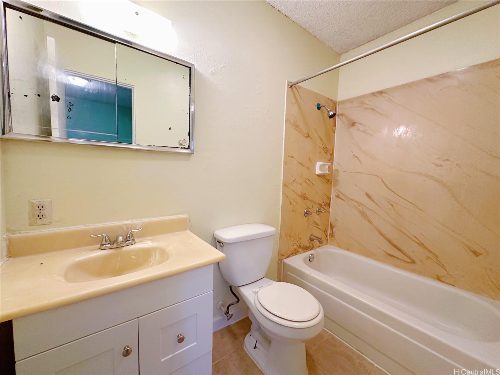 142 Lakeview Circle Wahiawa, HI 96786 - Photo 9 of 10 a bathroom with a sink toilet and shower