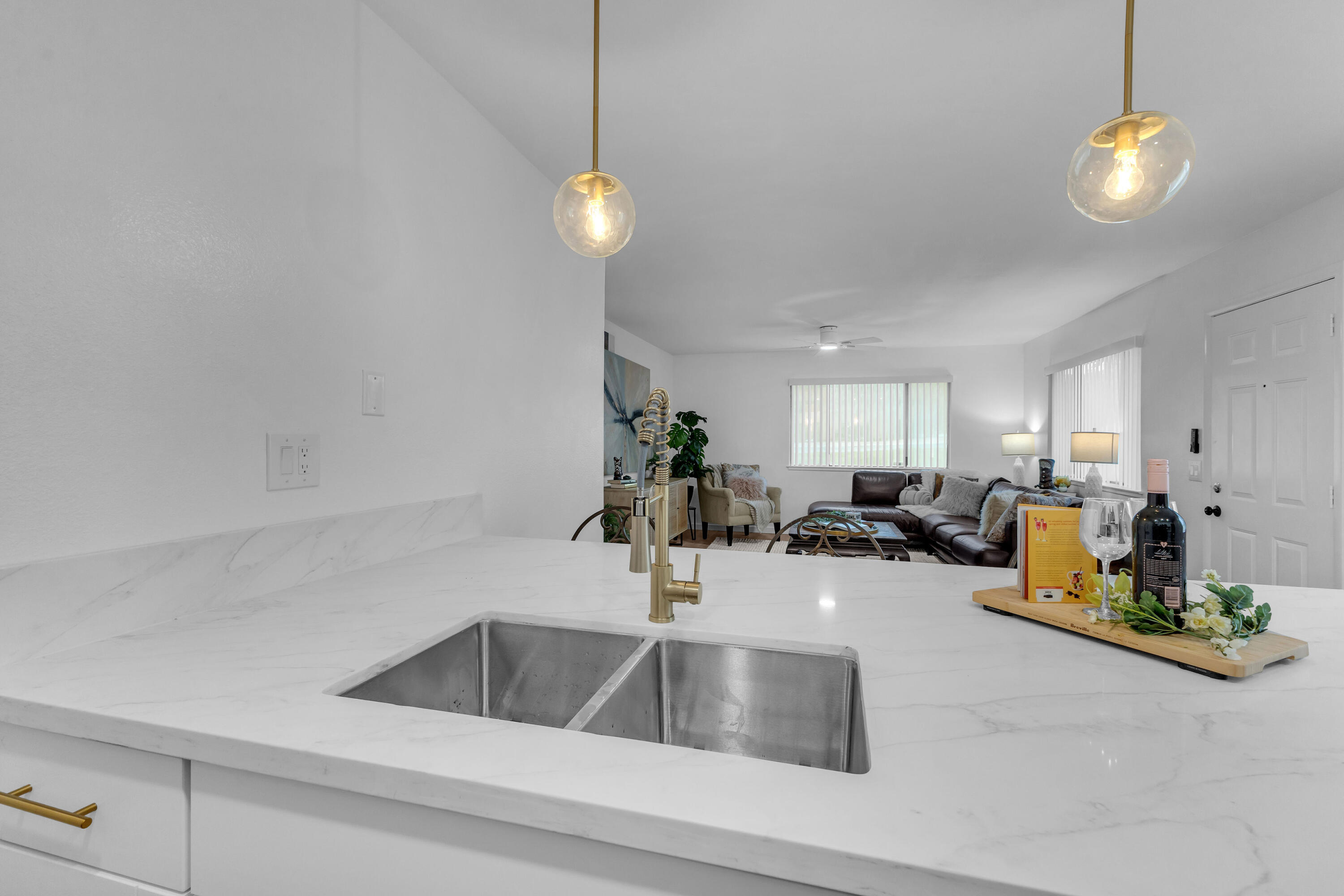 72682 Thrush Road, Unit 1 Palm Desert, CA 92260 - Photo 15 of 40 a kitchen with a sink and chandelier