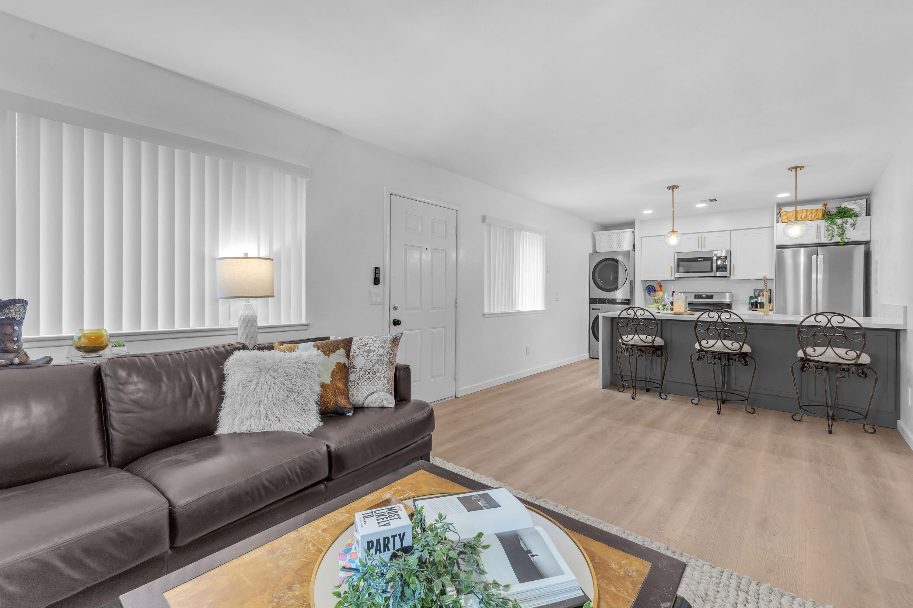 72682 Thrush Road, Unit 1 Palm Desert, CA 92260 - Photo 23 of 40 a living room with furniture and a large window