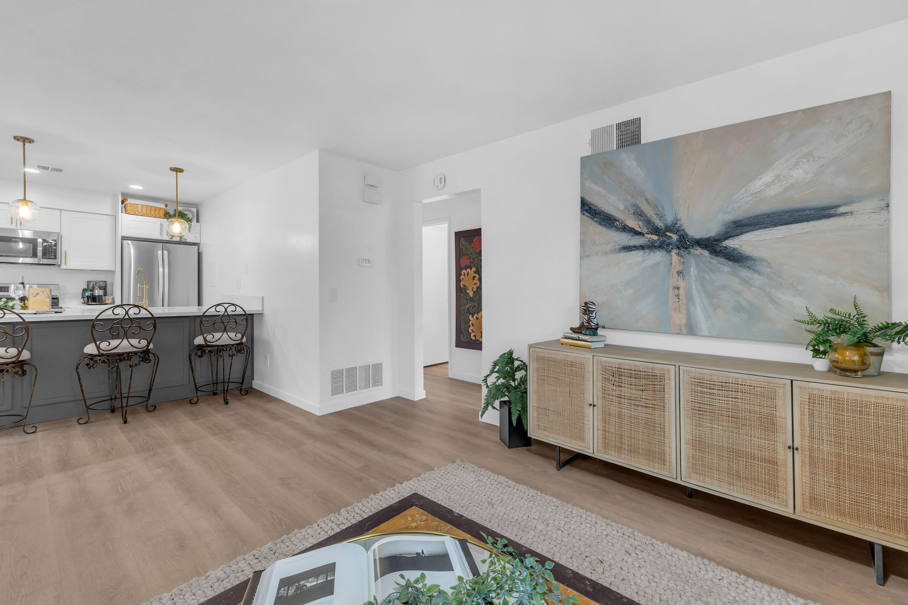 72682 Thrush Road, Unit 1 Palm Desert, CA 92260 - Photo 24 of 40 a spacious bedroom with a bed and a chandelier