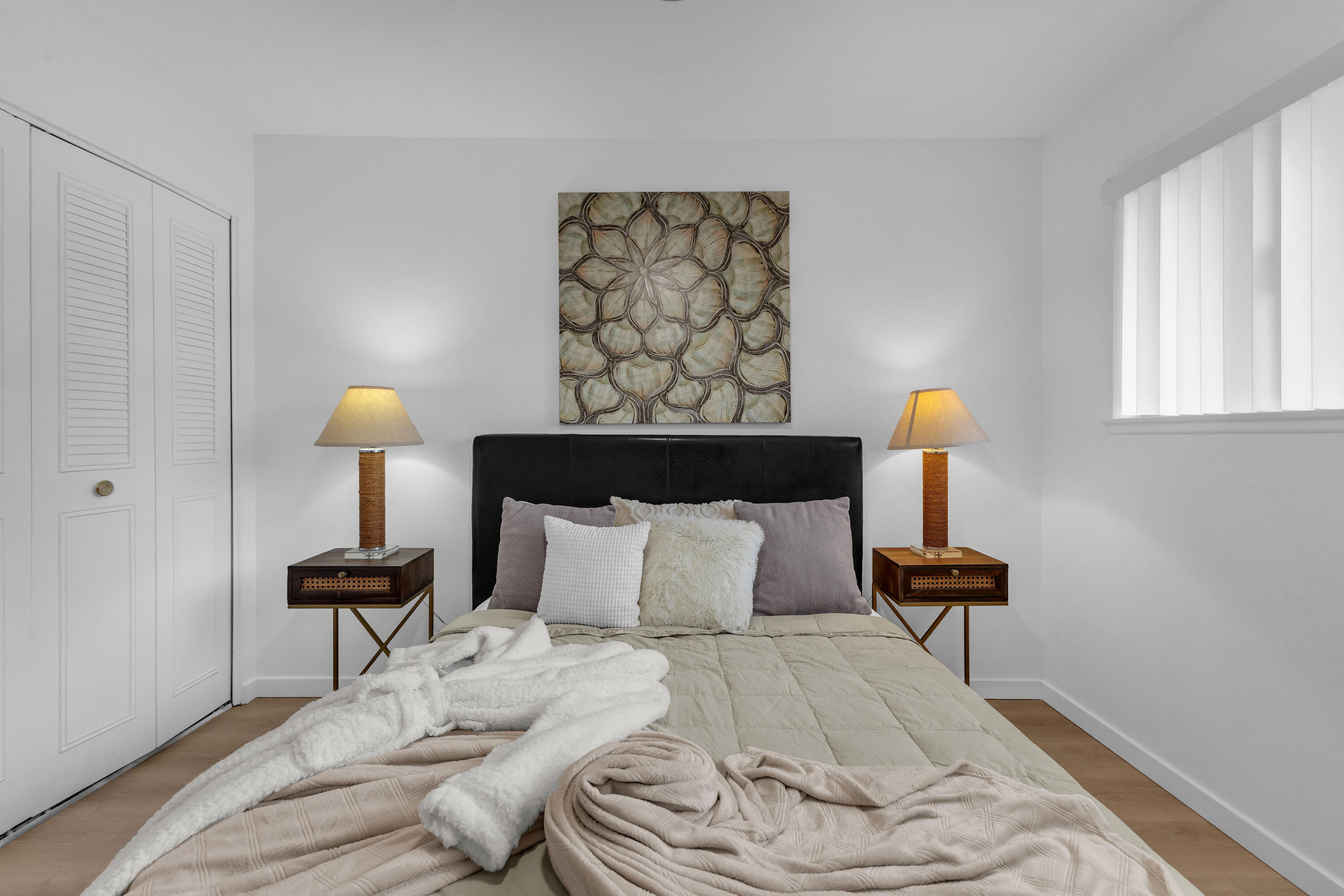 72682 Thrush Road, Unit 1 Palm Desert, CA 92260 - Photo 29 of 40 a bedroom with a bed and a lamp on table