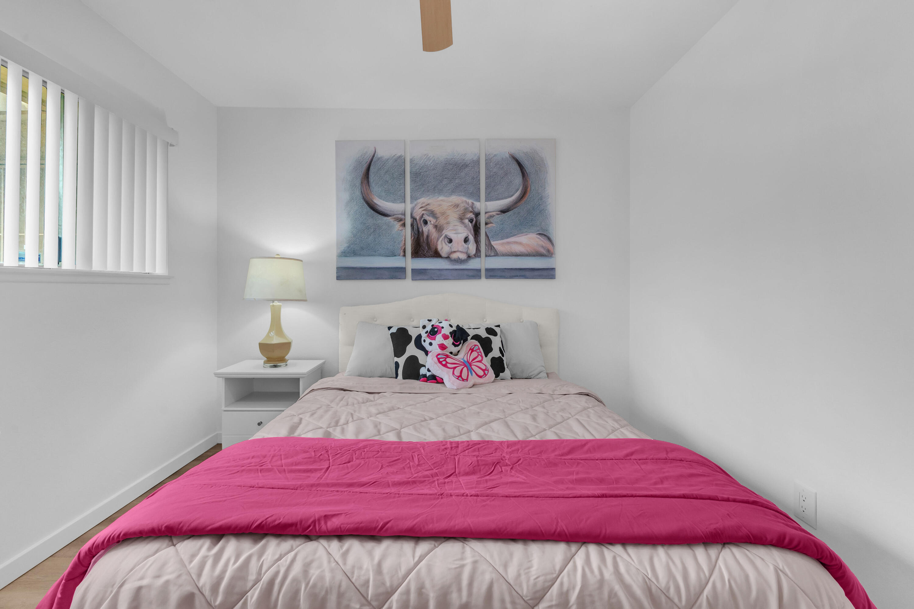 72682 Thrush Road, Unit 1 Palm Desert, CA 92260 - Photo 31 of 40 a bedroom with a bed and painting on the wall