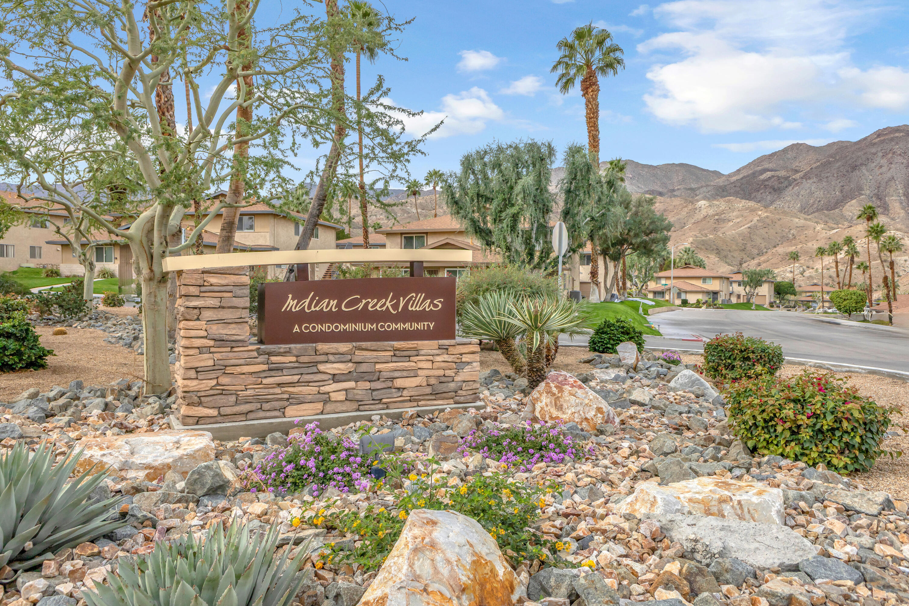 72682 Thrush Road, Unit 1 Palm Desert, CA 92260 - Photo 37 of 40 a view of a street with a tree in the background