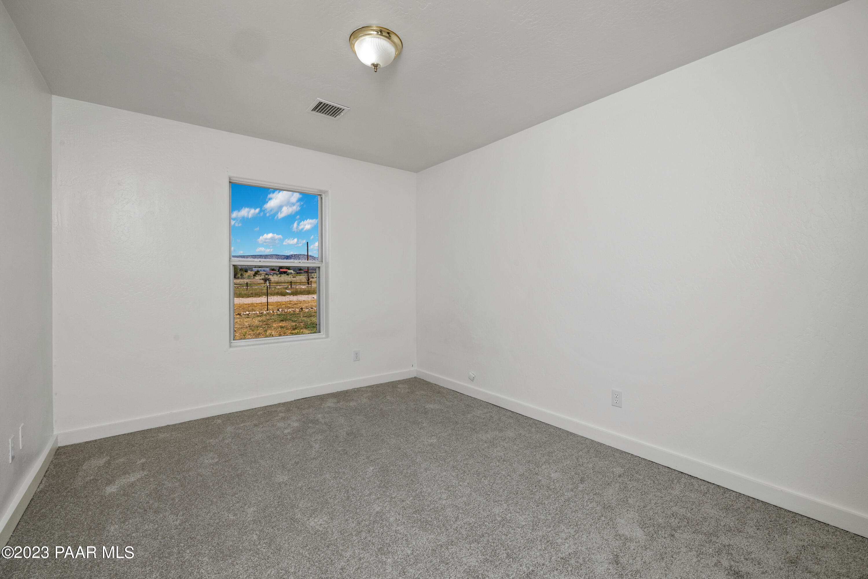 815 West Ahonen Road, Unit 4 Paulden, AZ 86334 - Photo 13 of 27 an empty room with windows