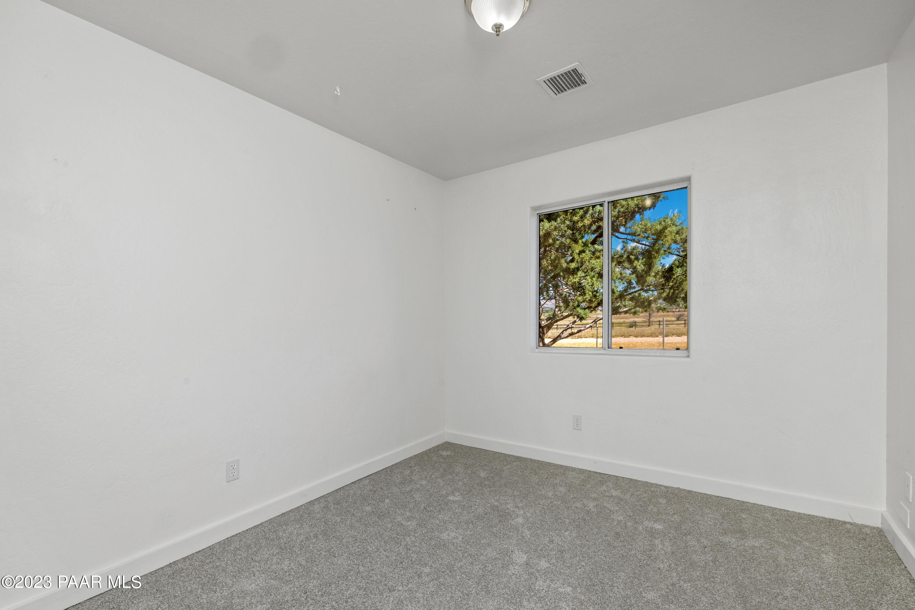 815 West Ahonen Road, Unit 4 Paulden, AZ 86334 - Photo 15 of 27 an empty room with a window