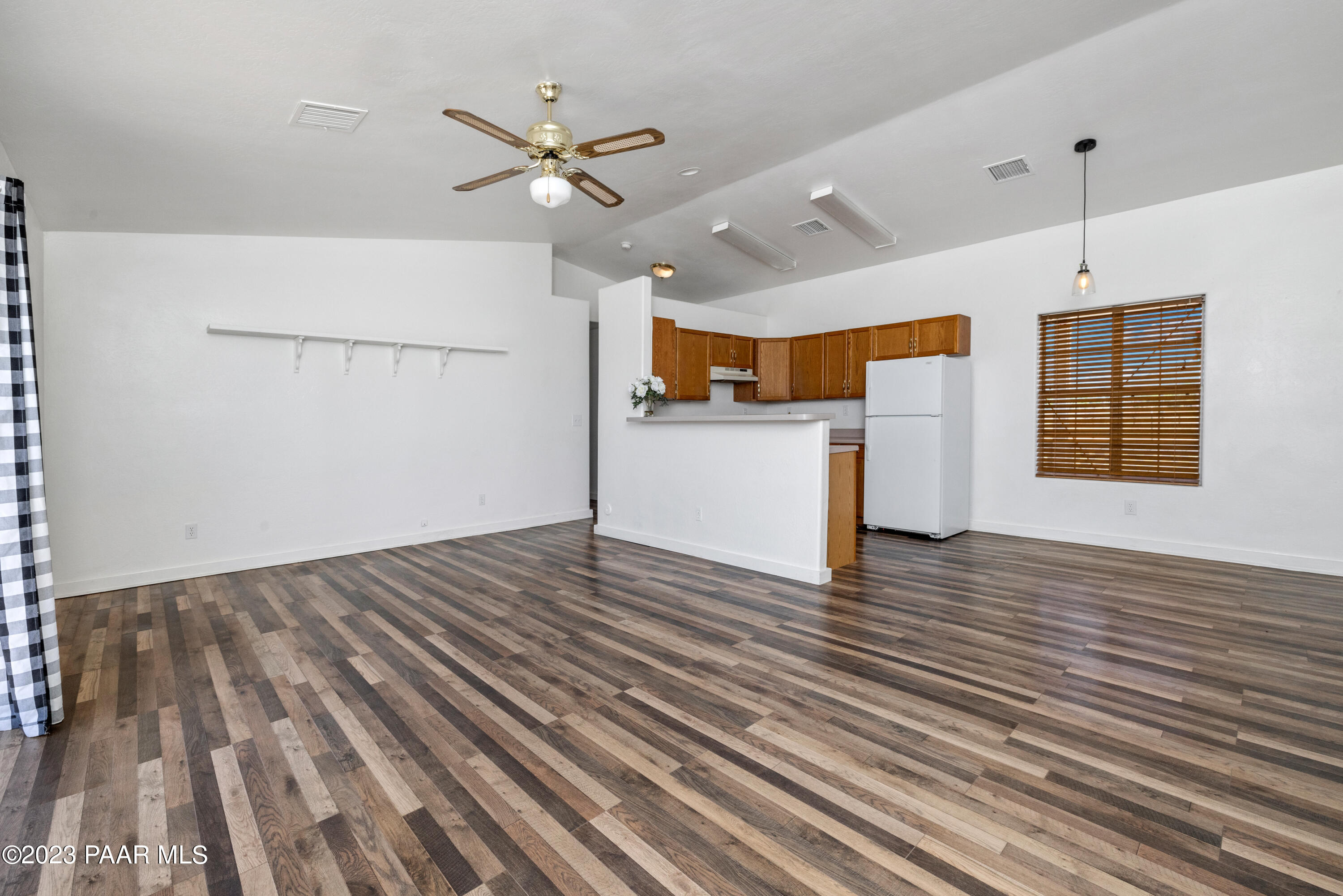 815 West Ahonen Road, Unit 4 Paulden, AZ 86334 - Photo 7 of 27 a view of empty room with wooden floor and fan