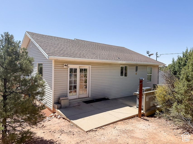 425 East Mule Deer Road Central, UT 84722 - Photo 58 of 72 Rear view of house with a shingled roof and a patio