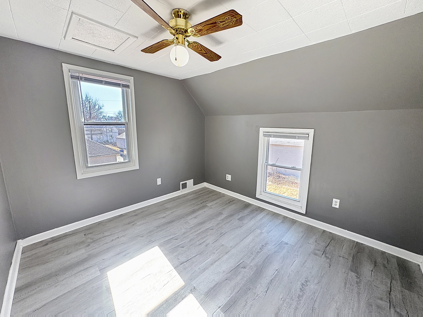 848 20th Avenue Moline, IL 61265 - Photo 17 of 20 a view of an empty room with a window and wooden floor
