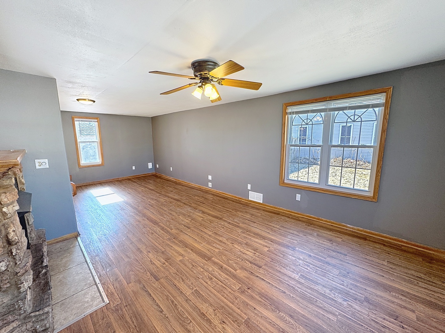 848 20th Avenue Moline, IL 61265 - Photo 2 of 20 a view of an empty room with window and wooden floor