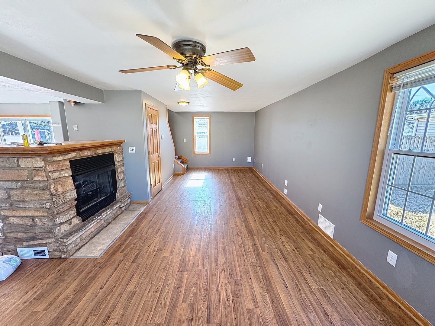 848 20th Avenue Moline, IL 61265 - Photo 3 of 20 wooden floor in an empty room with a fireplace