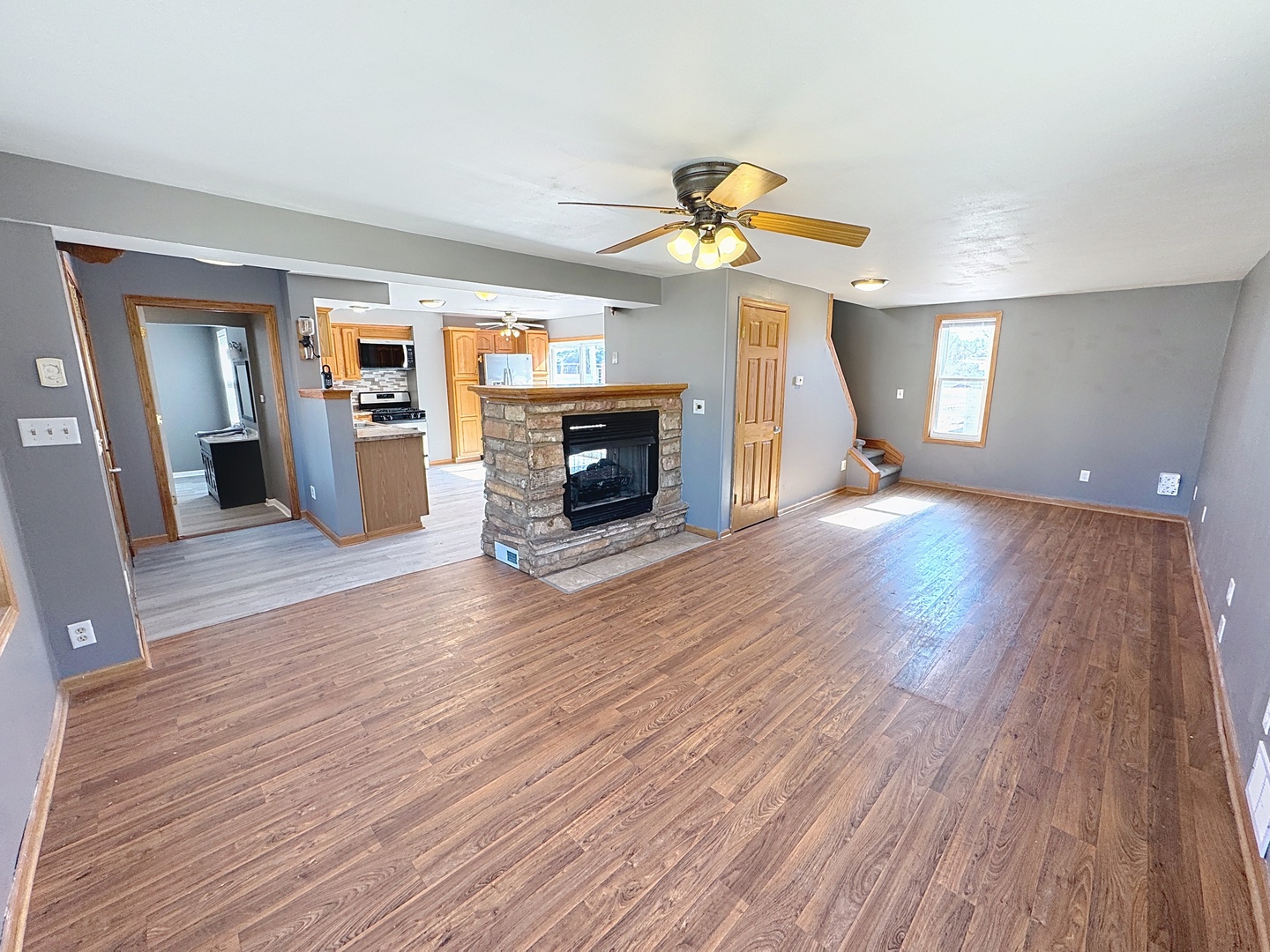 848 20th Avenue Moline, IL 61265 - Photo 4 of 20 wooden floor in an empty room with a fireplace