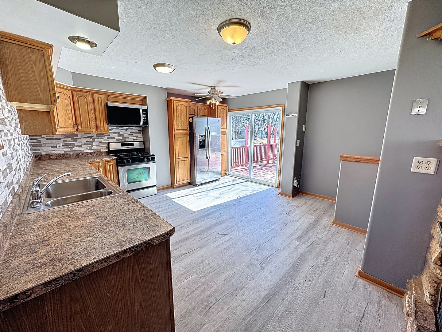 848 20th Avenue Moline, IL 61265 - Photo 6 of 20 a kitchen with stainless steel appliances granite countertop a sink stove and refrigerator