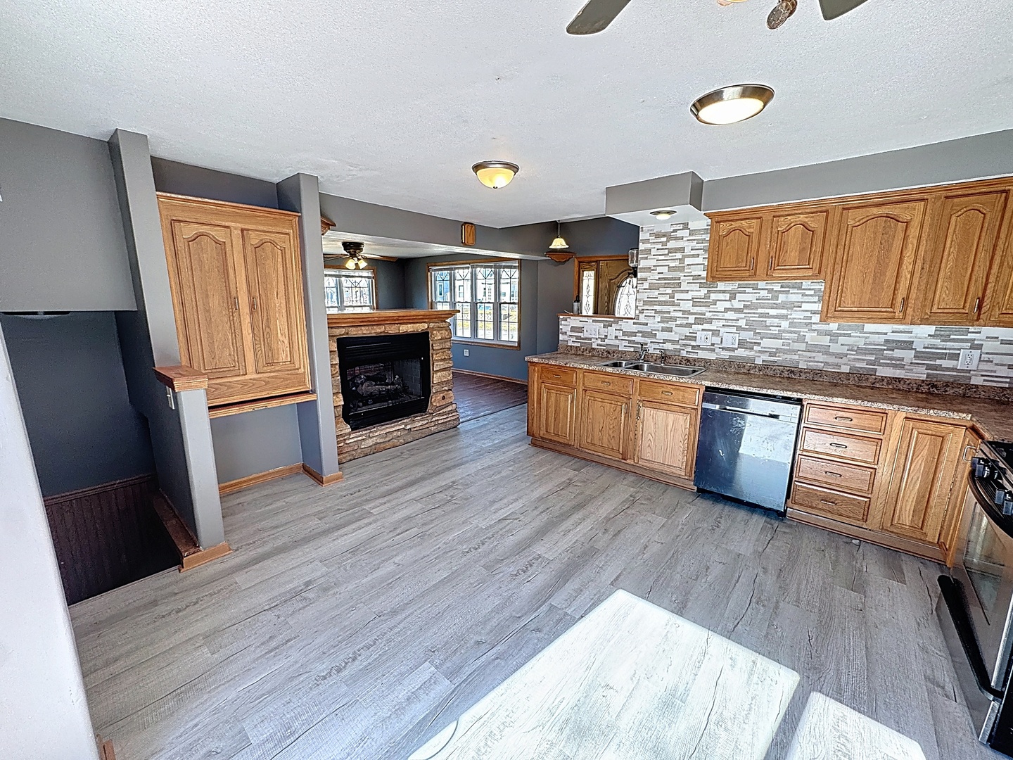 848 20th Avenue Moline, IL 61265 - Photo 8 of 20 a kitchen with stainless steel appliances granite countertop a stove and wooden floors