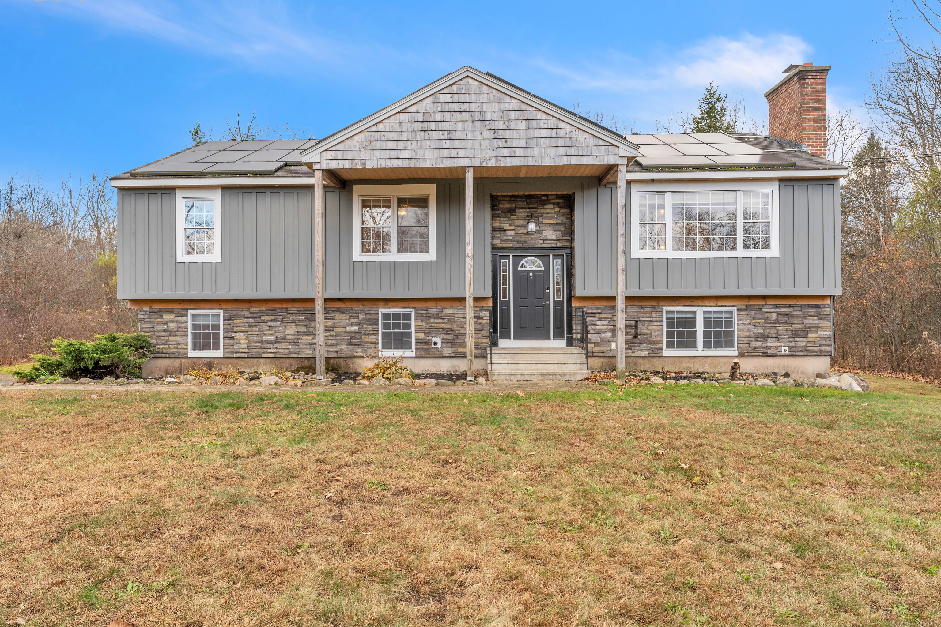 219 West Granby Road Granby, CT 06035 - Photo 1 of 1 a front view of a house with a yard