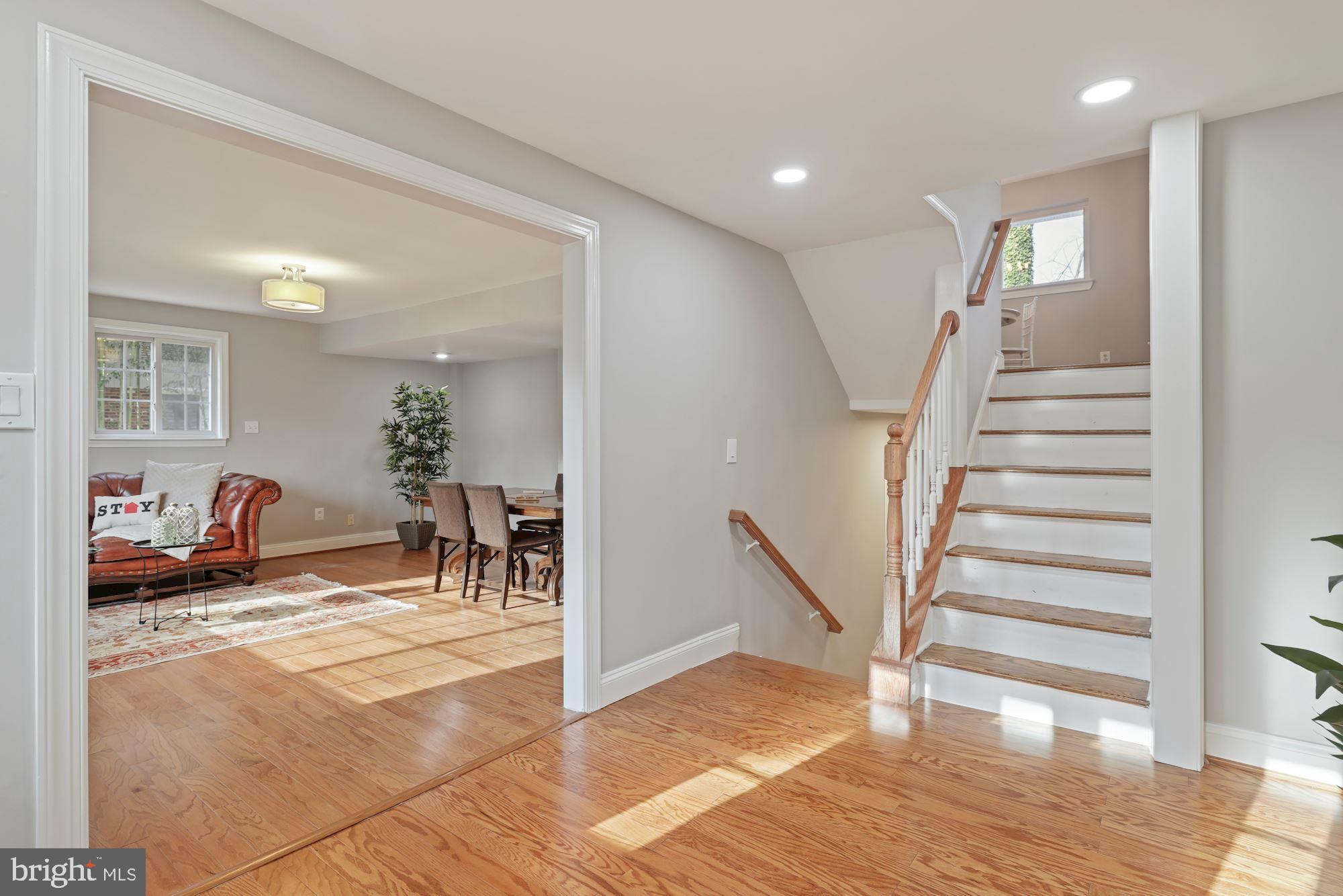7716 Beech Tree Road Bethesda, MD 20817 - Photo 5 of 49 a view of a hallway with a dining table and chairs