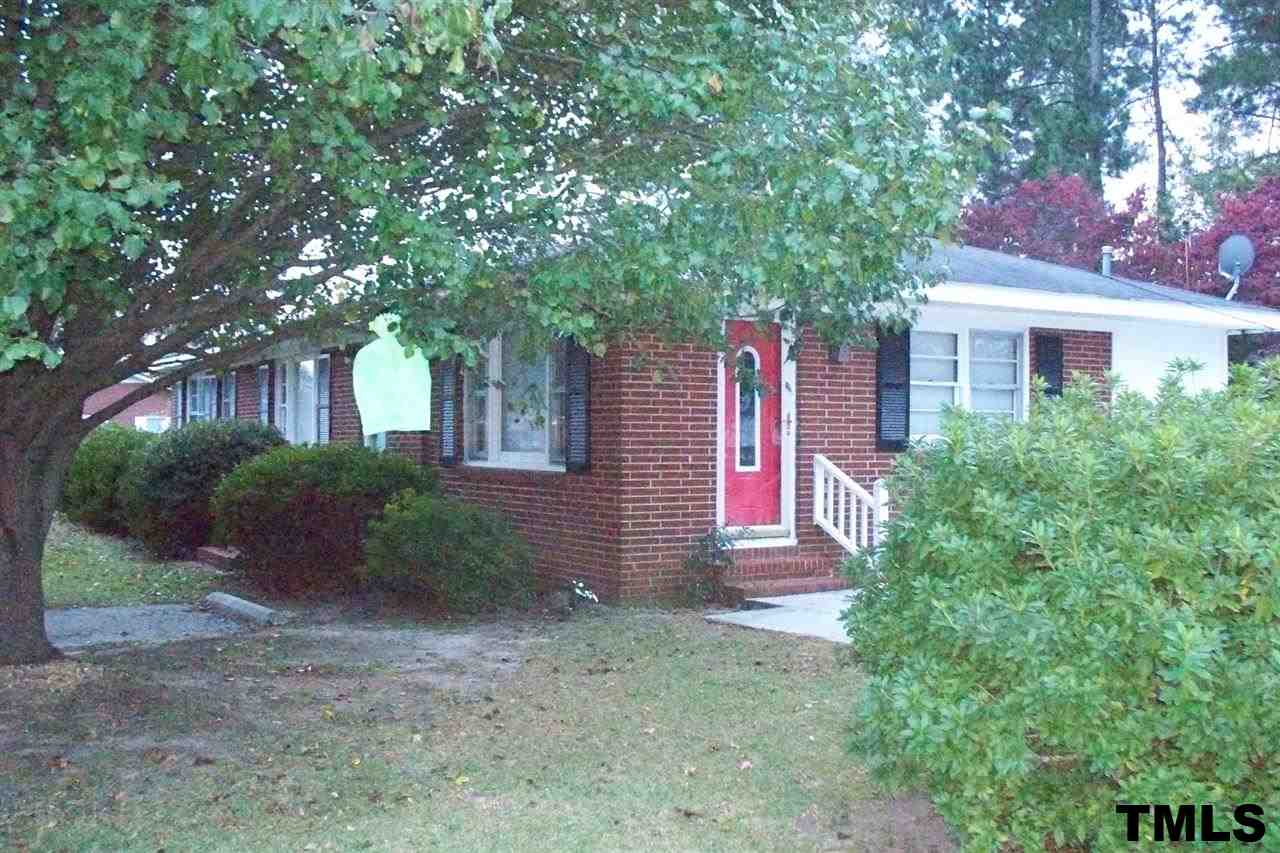 1303 Fairground Road Dunn, NC 28334 - Photo 22 of 23 a front view of a house with yard and green space