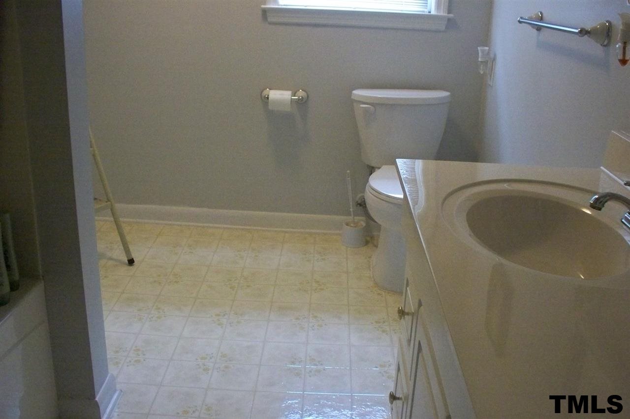 1303 Fairground Road Dunn, NC 28334 - Photo 8 of 23 a bathroom with a sink and toilet