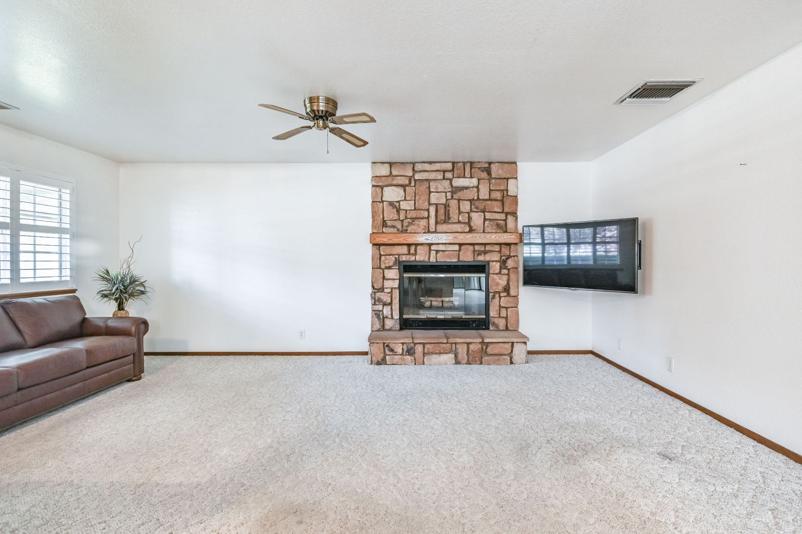 412 Lorene Court Ridgecrest, CA 93555 - Photo 11 of 31 a living room with furniture and a fireplace