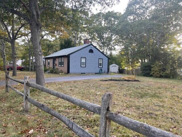 41 Bacon Road Hyannis, MA 02601 - Photo 14 of 22 a front view of a house with a yard and large tree