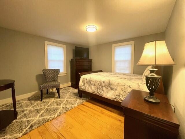 41 Bacon Road Hyannis, MA 02601 - Photo 8 of 22 a bedroom with a bed and a chair