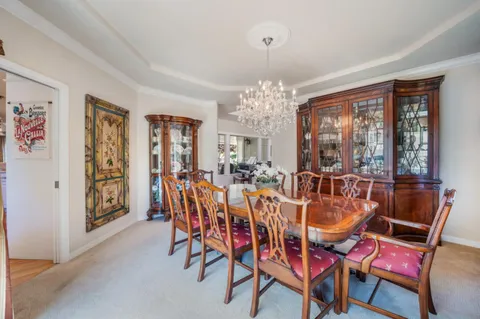 a living room with furniture fireplace and a window